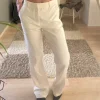 Vita kostymbyxor